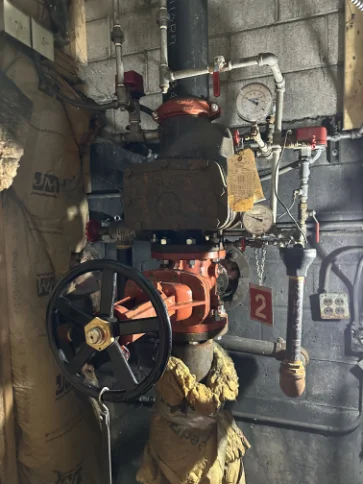 Commercial fire main backflow preventer system installation and inspection setup.
