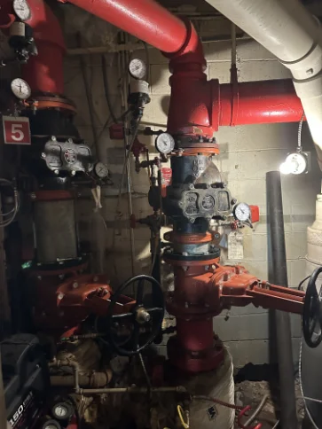 Heavy-duty fire sprinkler riser manifold system with integrated pressure gauges and control valves.