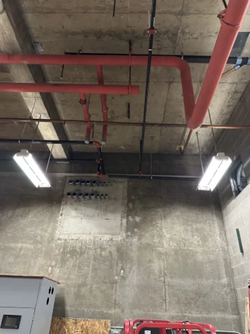 High-clearance commercial fire suppression system overhead installation.
